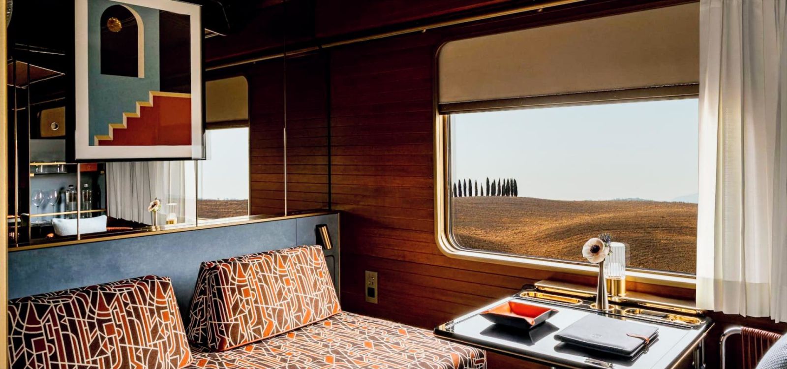 Lounge bar with soft amber lighting and panoramic windows